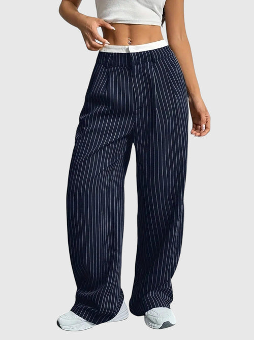 My Store Abigail high waisted wide leg pinstripe pants in navy blue with an elastic waistband on a model