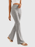 My Store Sophia high-waisted grey ribbed flare pants worn by a model with beige slide sandals