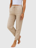 My Store Luna beige drawstring pants with elastic waist and relaxed tapered fit on a model