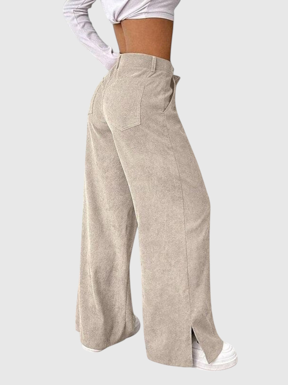 My Store Peyton high-waisted wide-leg corduroy pants in beige with side hem slits, shown from a side profile view.