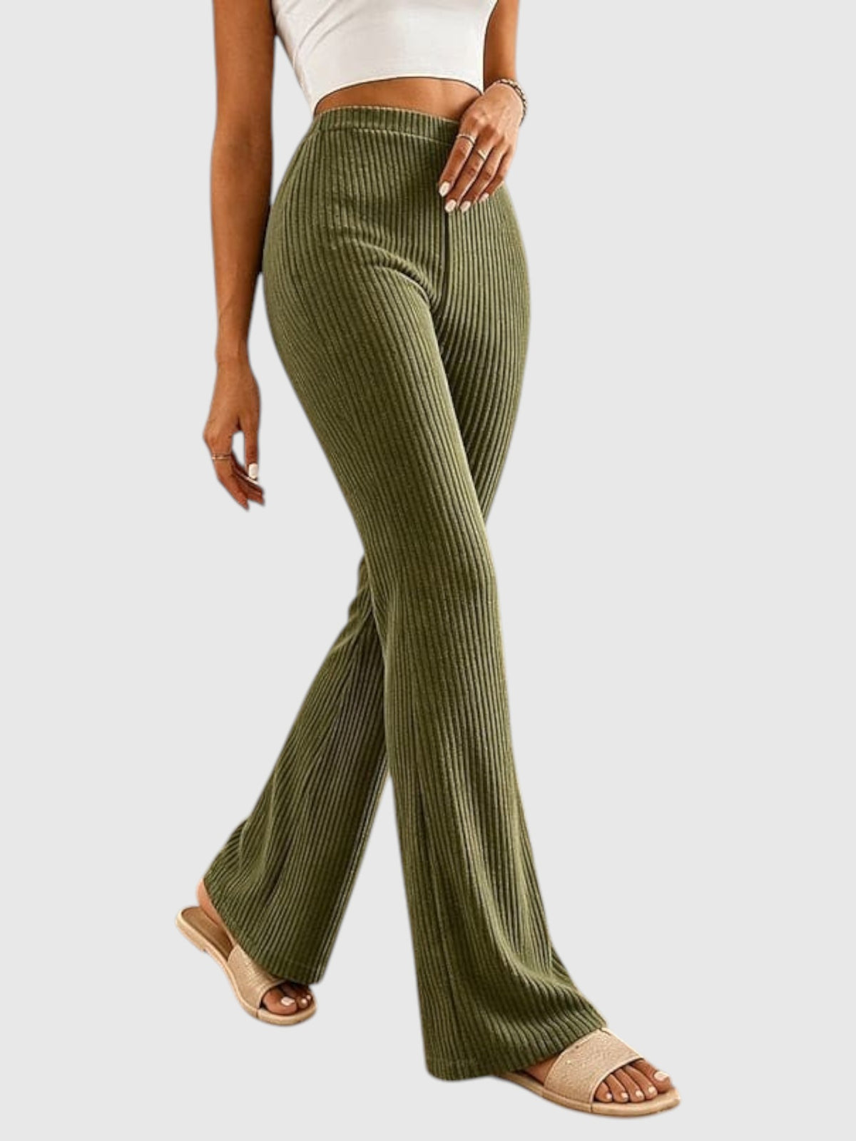 My Store Sophia high-waisted olive green ribbed flare pants worn with a white crop top and beige slide sandals